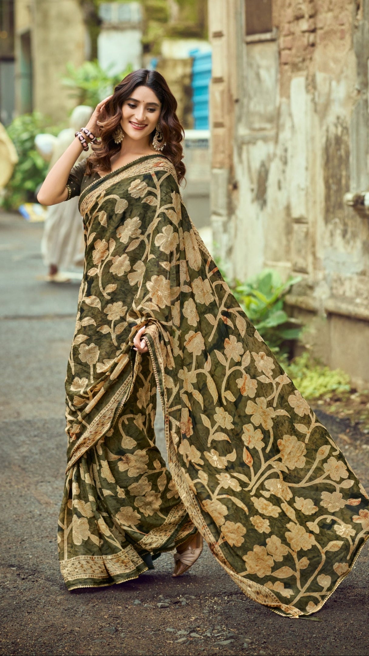 Olive green Brasso Silk saree with foil floral print and elegant zari border