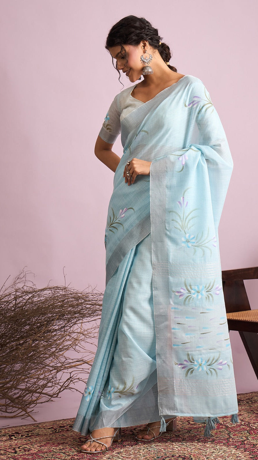 Sky blue lightweight linen cotton saree with floral design and tassel pallu