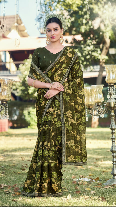 Woman wearing a green saree with floral patterns in an outdoor setting