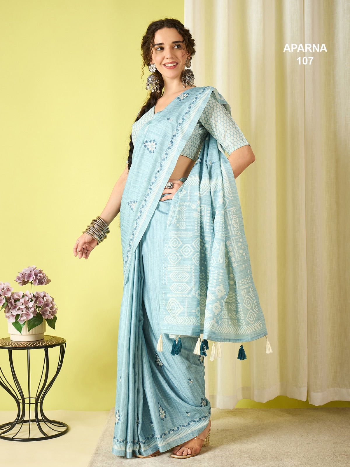 Powder blue cotton blend saree featuring woven ethnic pallu, stylish butti patterns and soft breathable lightweight fabric