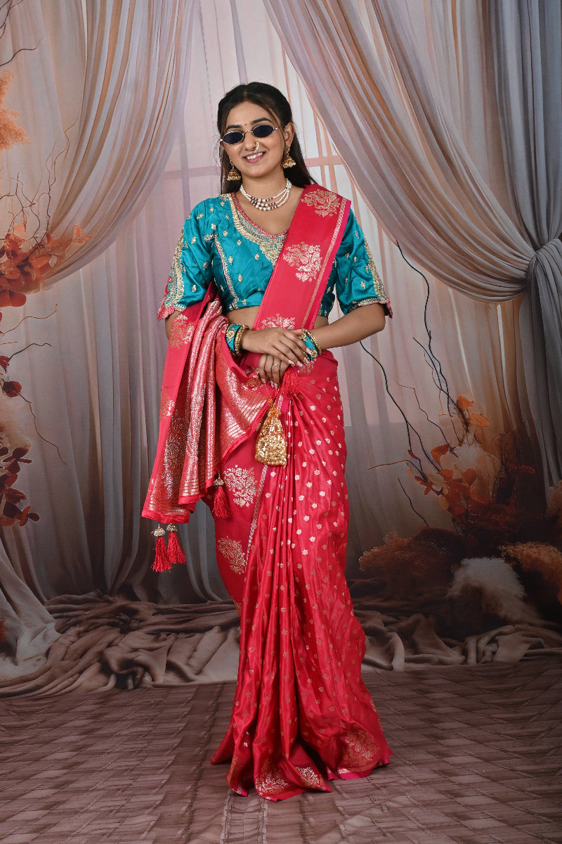 Woman holding a red saree in front of a mirror