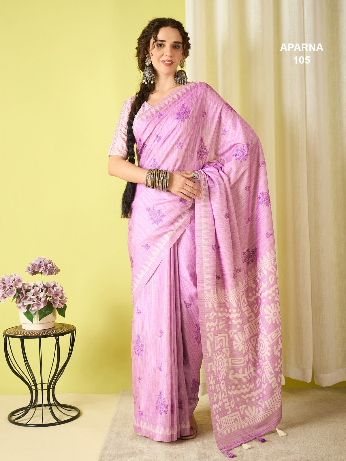Premium orchid pink cotton blend saree featuring tribal woven pallu, soft printed design and lightweight festive ethnic look