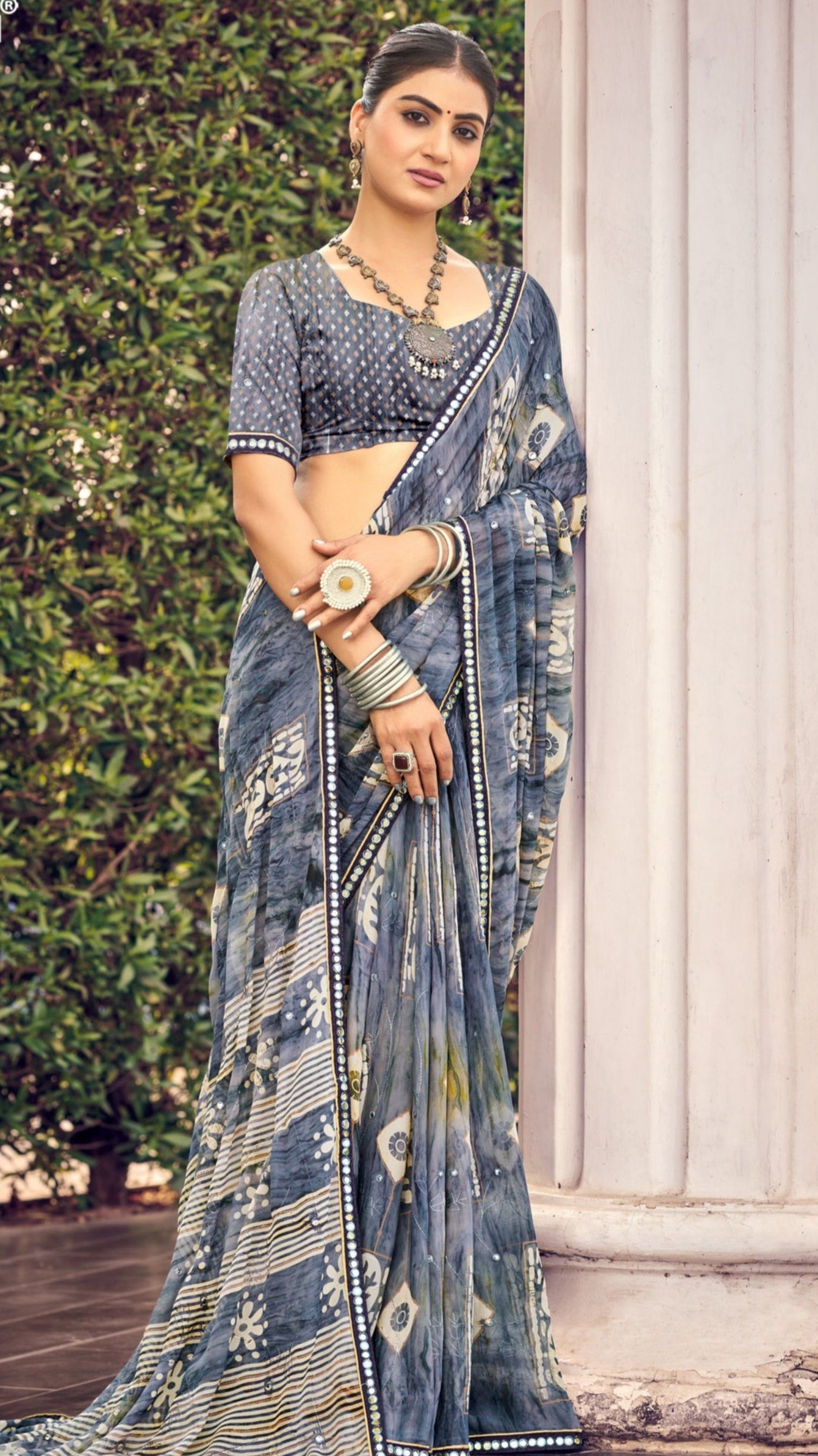 Smoky grey traditional printed synthetic silk saree with foil mirror work border