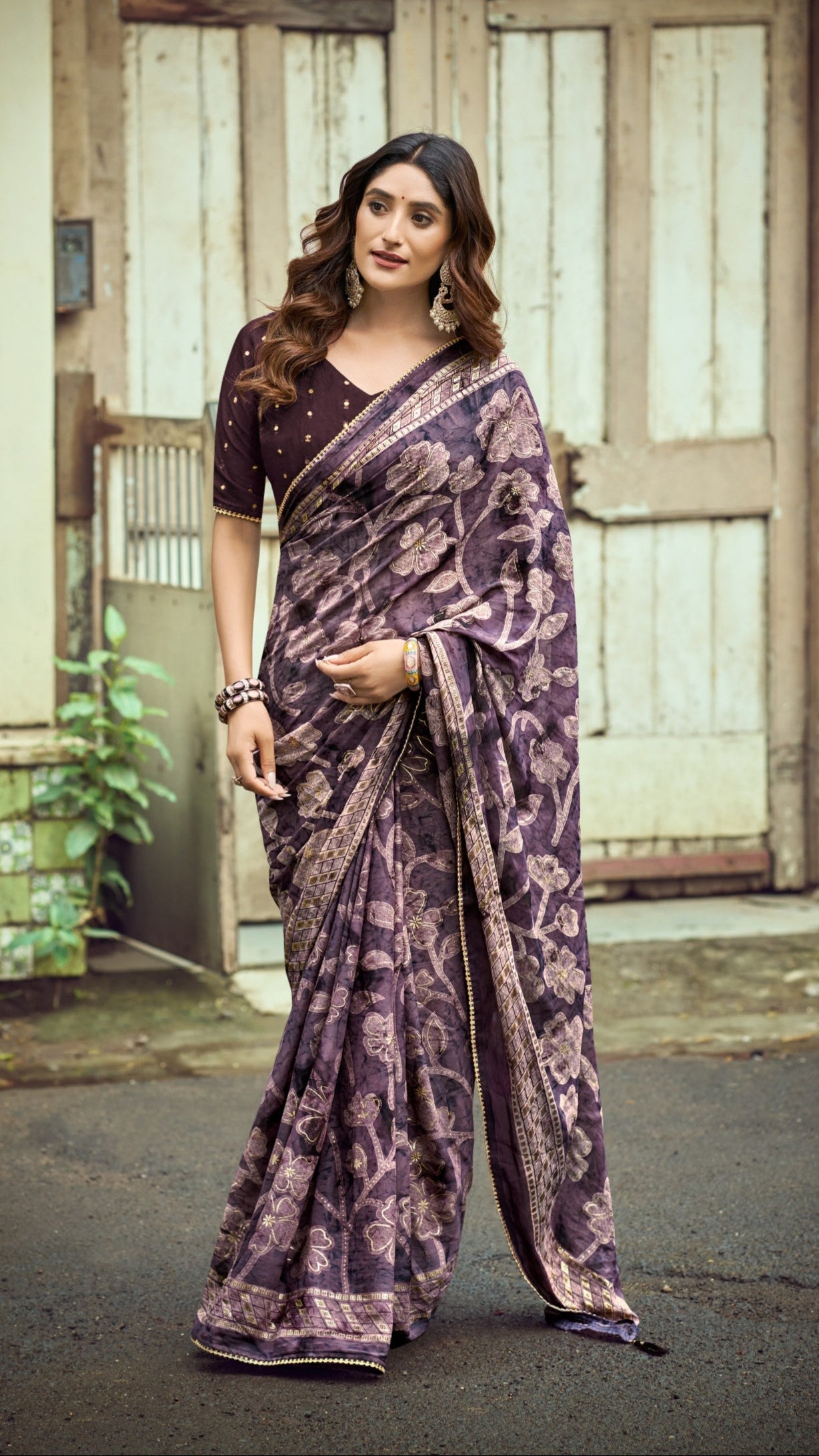 Royal plum Brasso Silk saree with elegant foil floral print and zari border