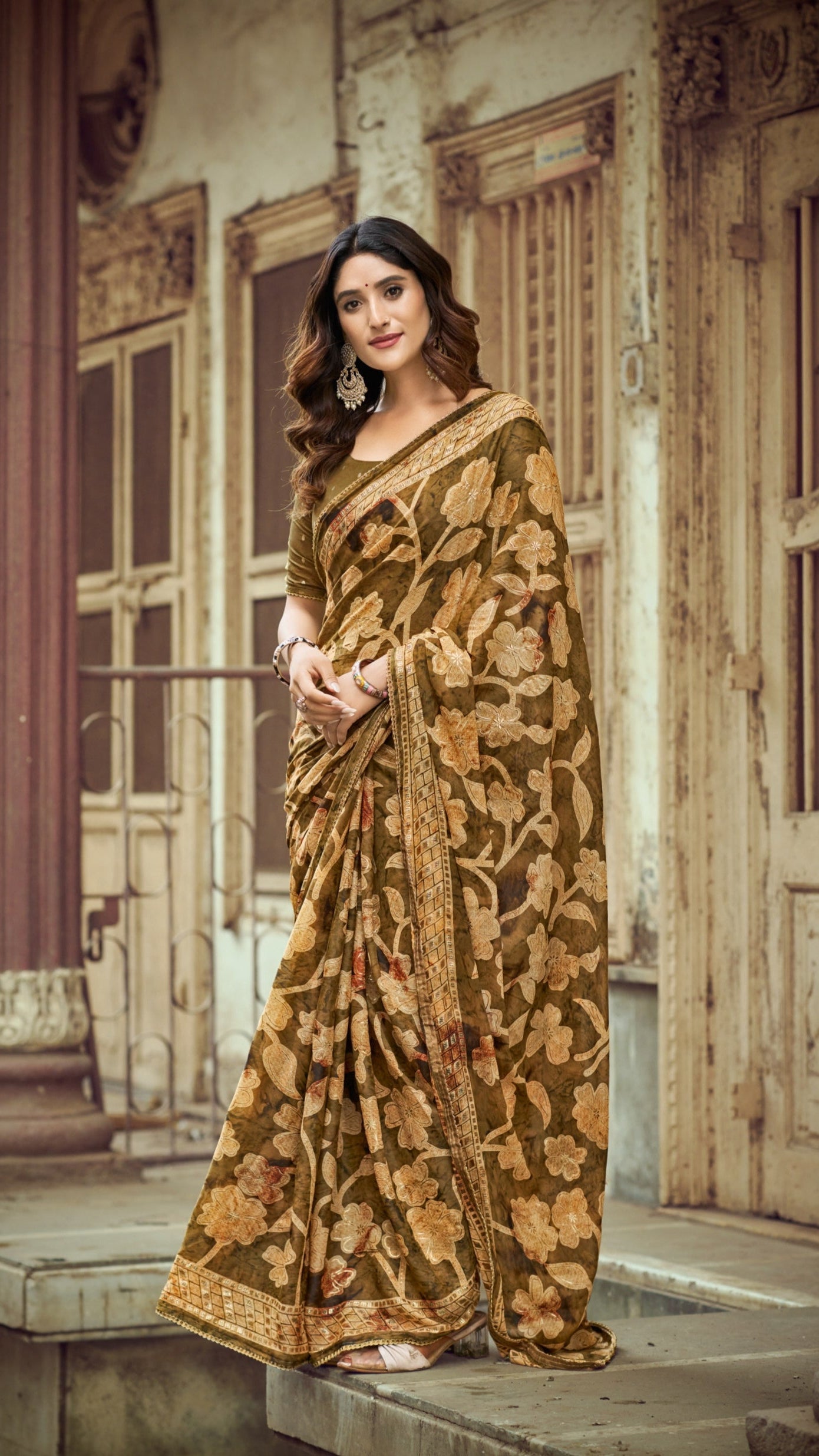 Olive gold Brasso Silk saree with foil floral print and designer zari border