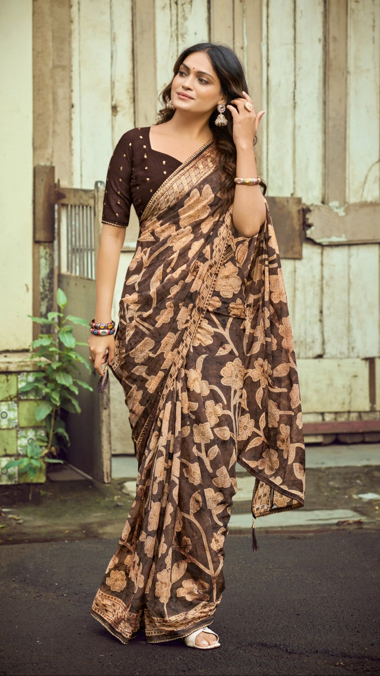 Chocolate brown Brasso Silk saree with floral foil print and zari border