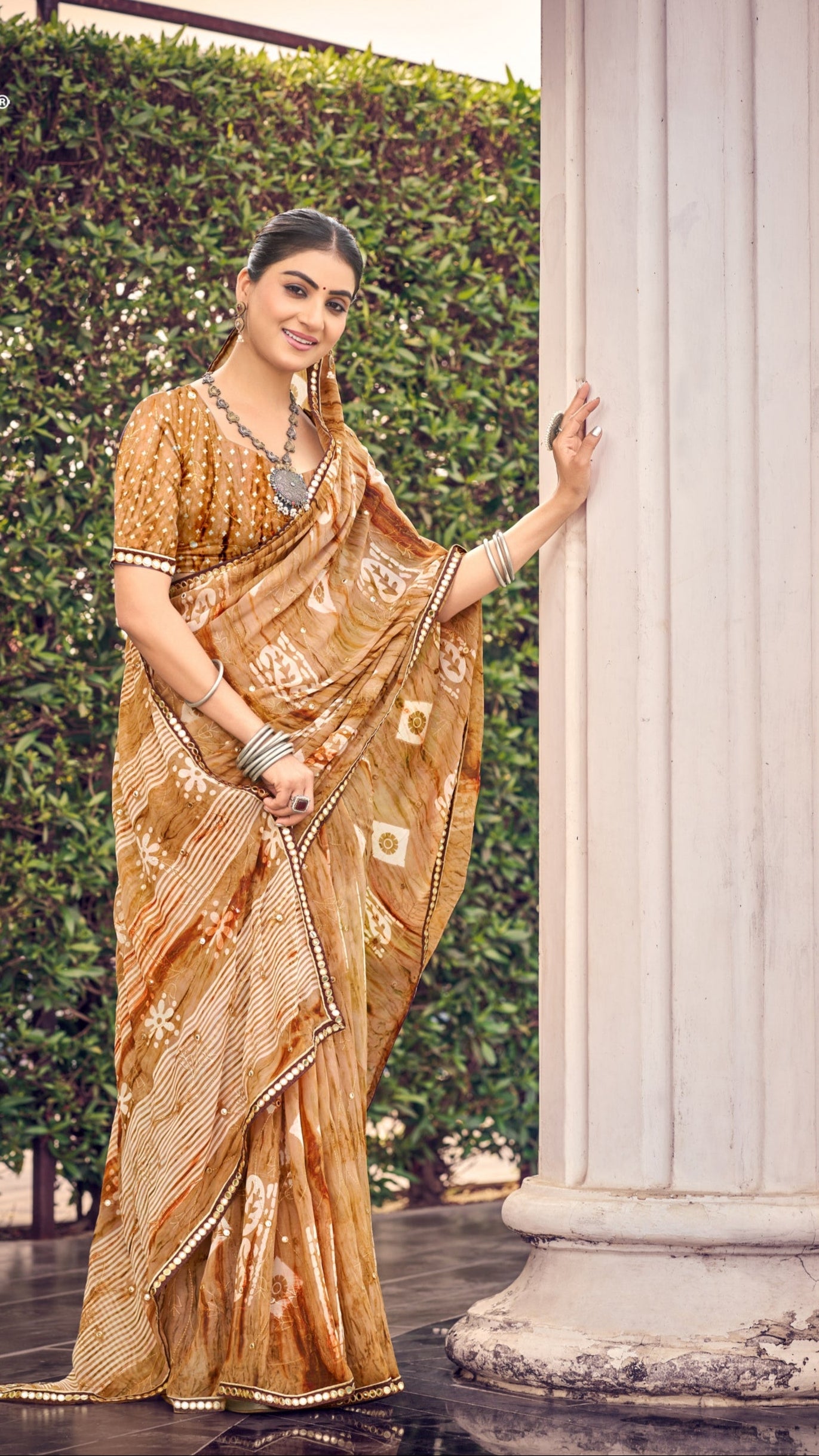 Golden beige traditional printed synthetic silk saree with foil mirror work border
