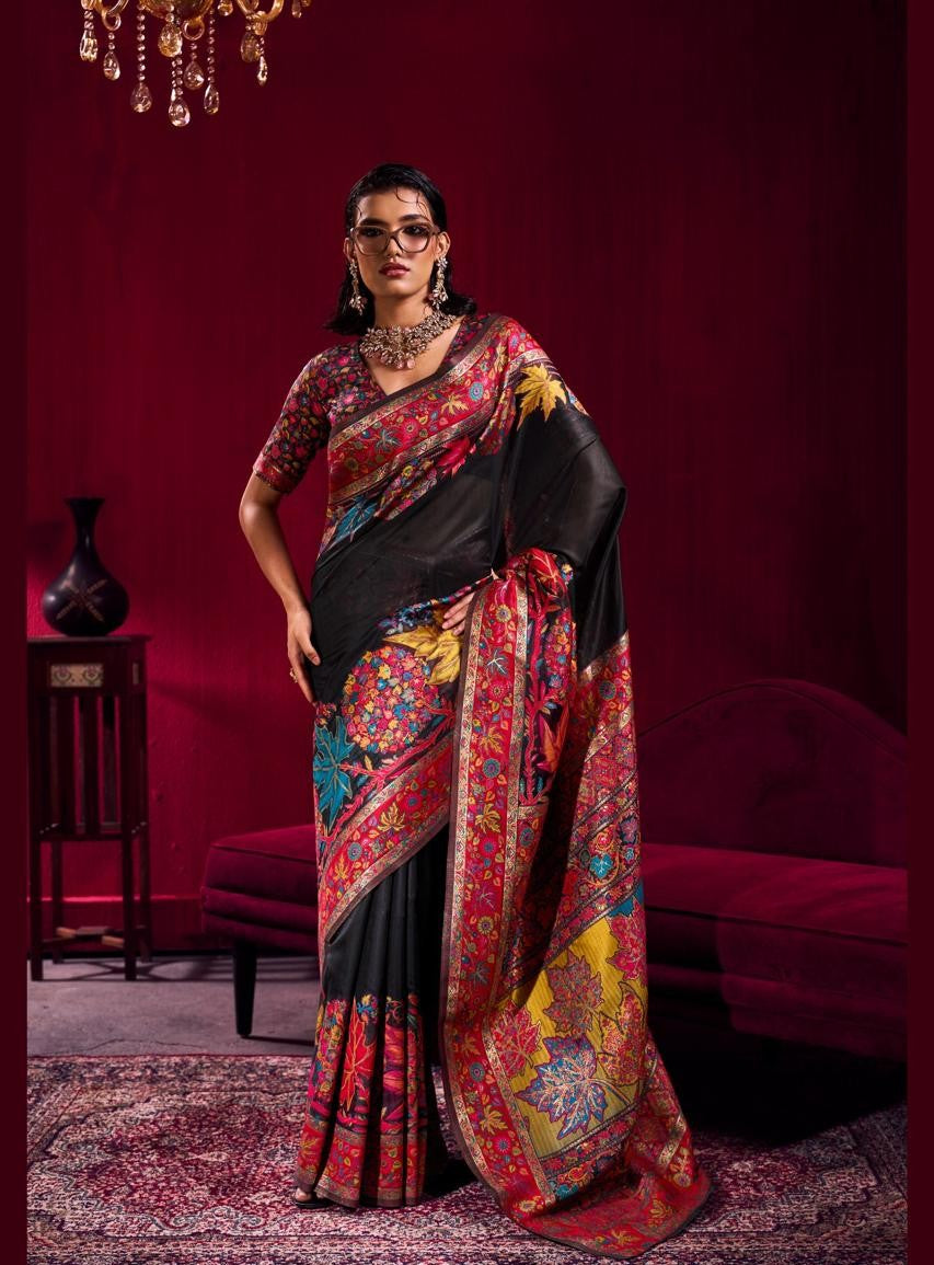 Woman wearing a colorful saree with a red background