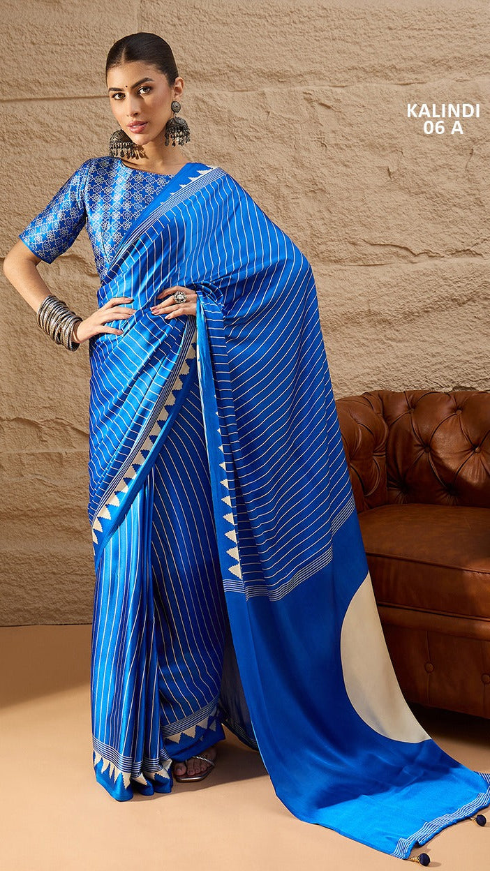 Royal blue Italian silk printed saree with striped design and running blouse by Krishna Textile Market