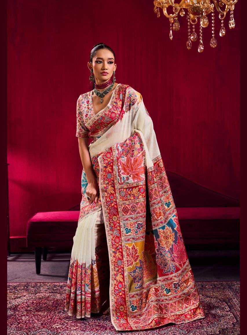 Woman wearing a colorful saree with a red background